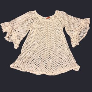 White lace bell sleeve blouse with ruffle details.